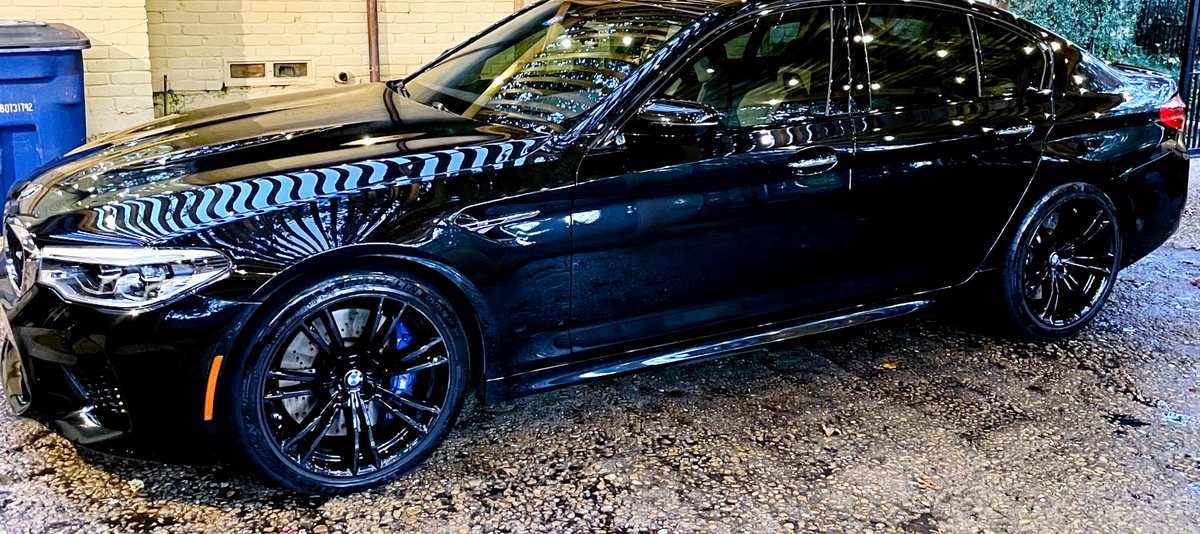 Black sedan with a mirror-gloss ceramic coated finish