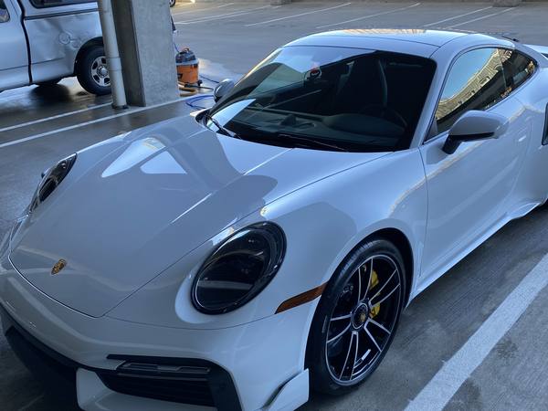 White Porsche 911 with a glossy detailed finish